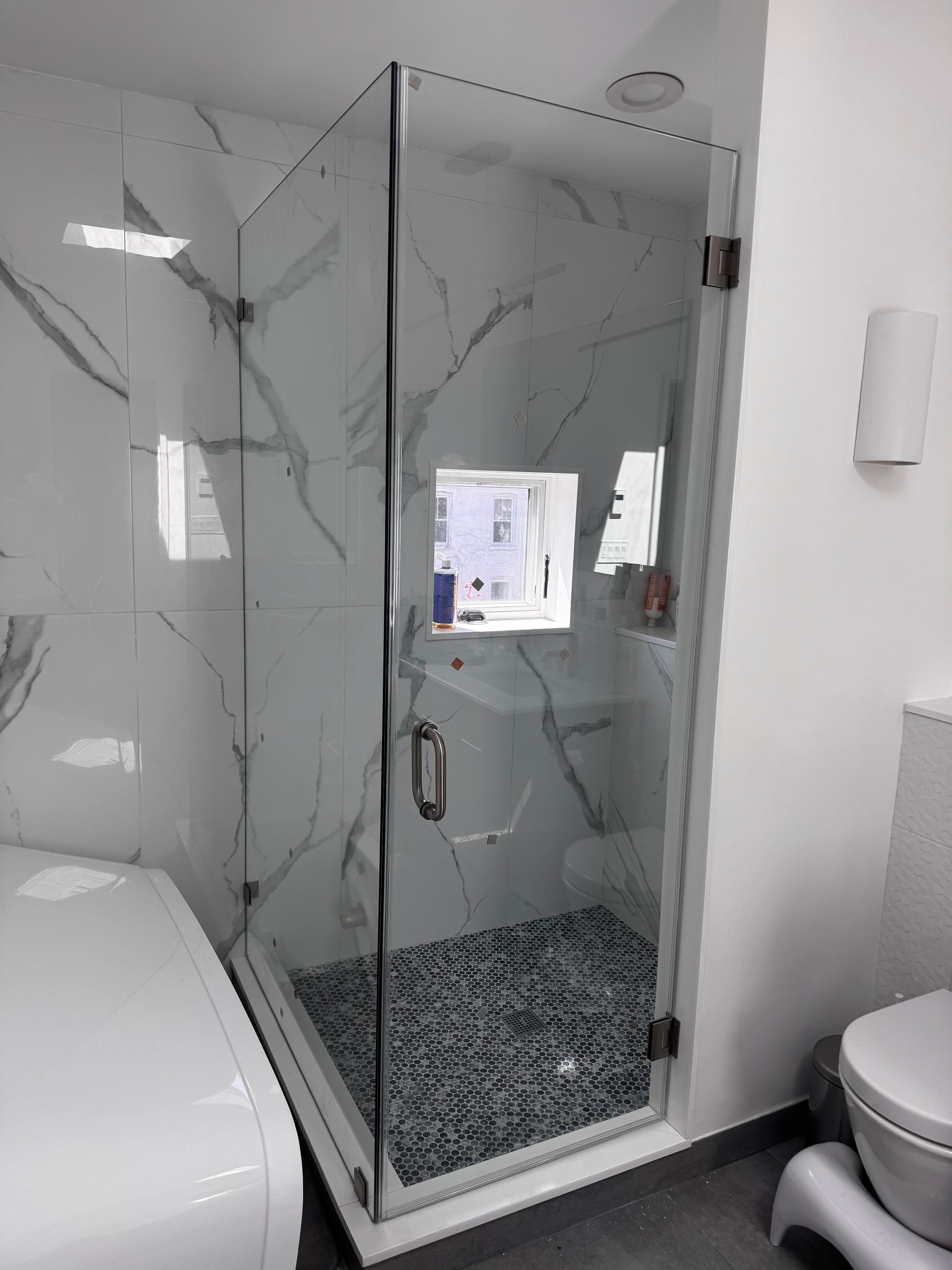 Corner Swing Door shower door installation in Monticello